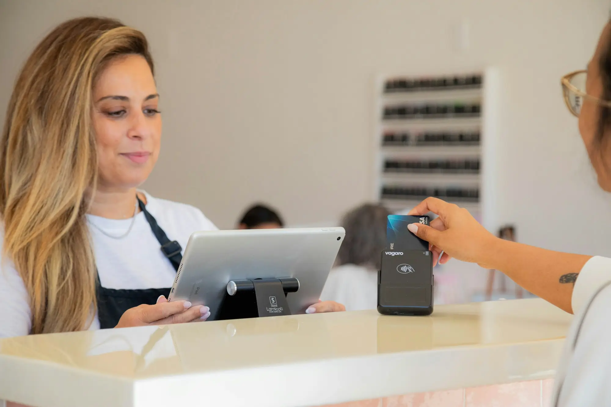 Customer making a card payment at a shop counter
